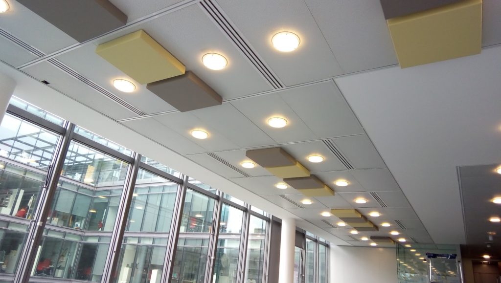 3D ceiling tiles installed in an office T24 grid