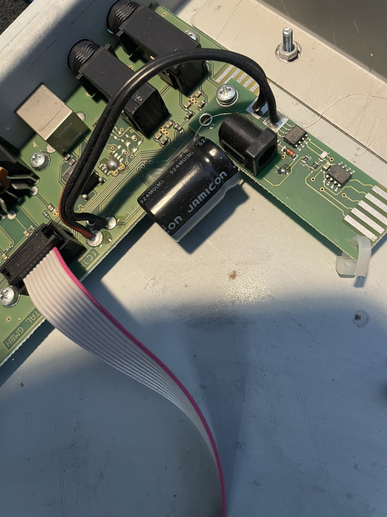 access virus polar large capacitor across power plug